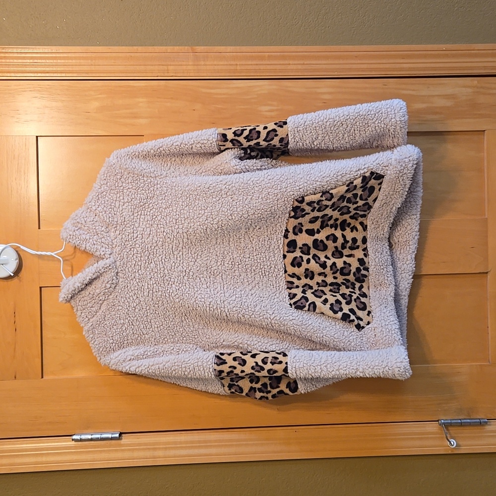 Sherpa and animal print pullover.